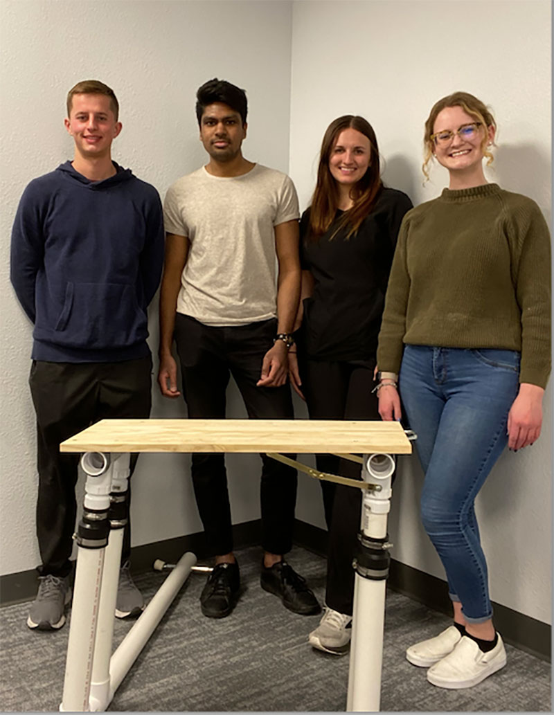 Toilet Fall Prevention team standing behind their creation