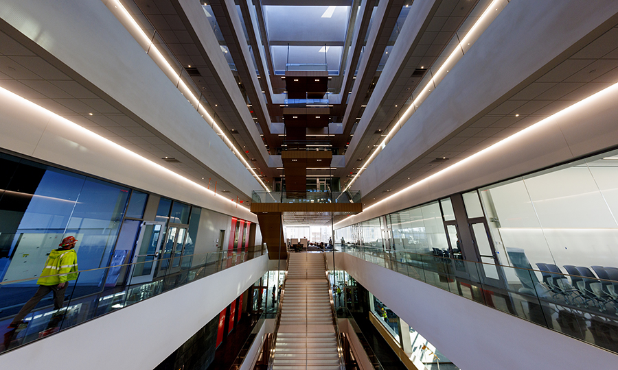 A grand staircase, which hangs from the ceiling instead of being anchored to the ground floor, is one of Kiewit Hall's signature features. (Craig Chandler / University Communication & Marketing)