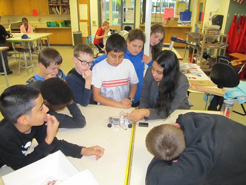 2016: Children listening to Dr. Dishari at the Culler Middle School after school science program.