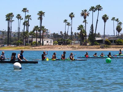 The UNL Concrete Canoe team competes down south with palm trees in the background.