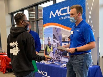 Student and recruiter talk at the Durham School Career Fair.